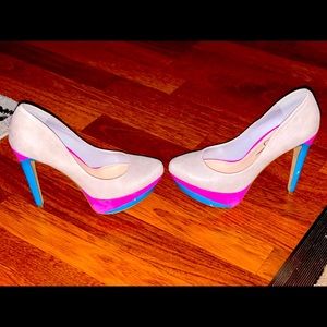 Jessica Simpson nude, pink and blue platform heels.
